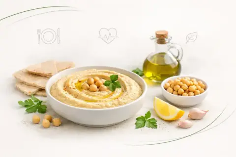 Pyszne, kremowe hummus z ciecierzycą, oliwą, cytryną i czosnkiem. Idealna przekąska, która pokazuje, co to jest hummus.